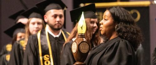 Centre students walking on stage at commencement ceremony